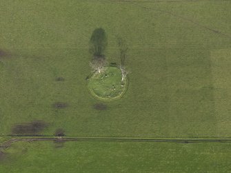 Oblique aerial view centred on the stone circle, taken from the SW.