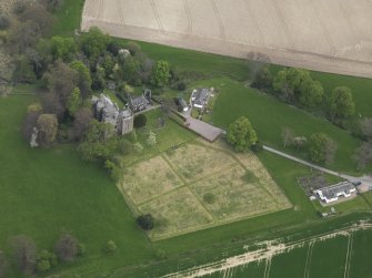 Oblique aerial view centred on the castle with the custodian's house adjacent, taken from the SW.