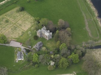 Oblique aerial view centred on the castle with the custodian's house adjacent, taken from the ESE.