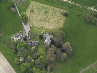 Oblique aerial view centred on the castle with the custodian's house adjacent, taken from the ENE.