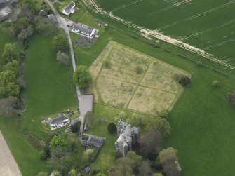 Oblique aerial view centred on the castle with the custodian's house adjacent, taken from the NE.