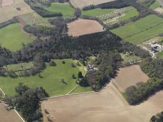 General oblique aerial view of the country house with the walled garden adjacent, taken from the E.