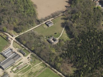 Oblique aerial view centred on the stable block, taken from the NW.