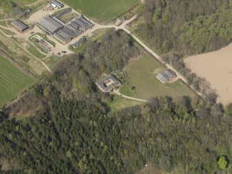 Oblique aerial view centred on the stable block, taken from the SSW.