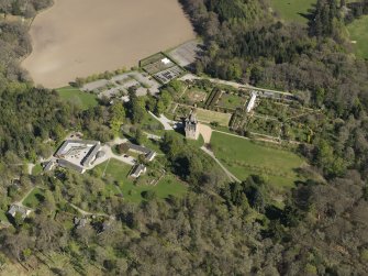Oblique aerial view centred on the castle with the garden adjacent, taken from the NW.