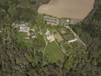 Oblique aerial view centred on the castle with the garden adjacent, taken from the SW.