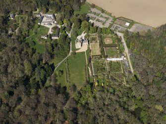 Oblique aerial view centred on the castle with the garden adjacent, taken from the SSW.