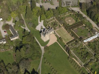 Oblique aerial view centred on the castle with the garden adjacent, taken from the SW.