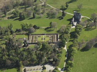 Oblique aerial view centred on the walled garden with the castle adjacent, taken from the ENE.