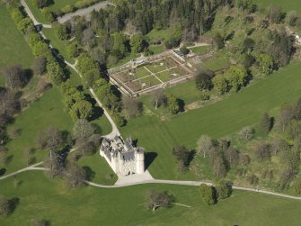 Oblique aerial view centred on the castle with the walled garden adjacent, taken from the SSW.