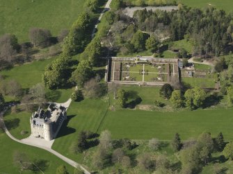 Oblique aerial view centred on the castle with the walled garden adjacent, taken from the SSE.
