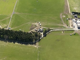 Oblique aerial view centred on the modern recumbent stone circle, taken from the NE.