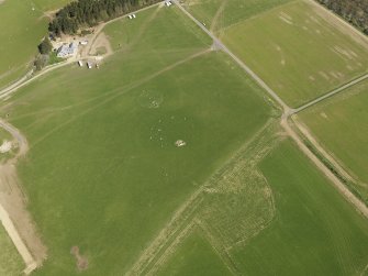 Oblique aerial view centred on the modern recumbent stone circle, taken from the WNW.