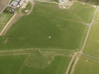 Oblique aerial view centred on the modern recumbent stone circle, taken from the SSW.