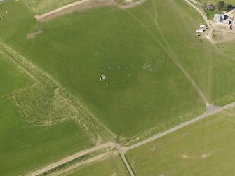 Oblique aerial view centred on the modern recumbent stone circle, taken from the SSE.