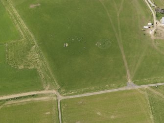 Oblique aerial view centred on the modern recumbent stone circle, taken from the SE.