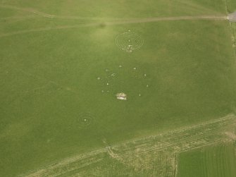 Oblique aerial view centred on the modern recumbent stone circle, taken from the SW.