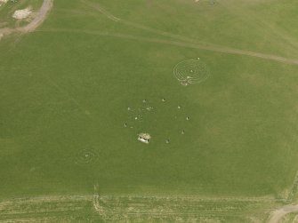 Oblique aerial view centred on the modern recumbent stone circle, taken from the S.