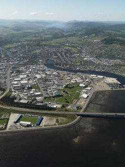 Oblique aerial view of the Citadel area of Inverness and the Longman Industrial Estate with Loch Ness beyond, taken from the NE.