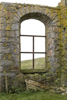 Interior.View of the south east facing window within the south west jamb of the church