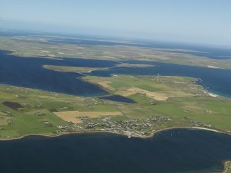 Oblique aerial view of Burray with the Churchill Barriers and Mainland beyond, taken from the S.
