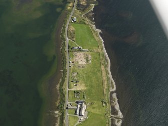 Oblique aerial view centred on the excavations of Brodgar settlement, taken from the NW.