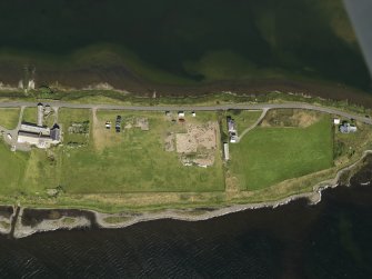 Oblique aerial view centred on the excavations of Brodgar settlement, taken from the SSE.