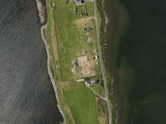 Oblique aerial view centred on the excavations of Brodgar settlement, taken from the SW.