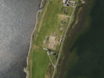 Oblique aerial view centred on the excavations of Brodgar settlement, taken from the SSW.