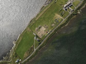 Oblique aerial view centred on the excavations of Brodgar settlement, taken from the NNE.