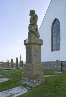 Figure gravestone to E of Church. by J Nicholson  Detail