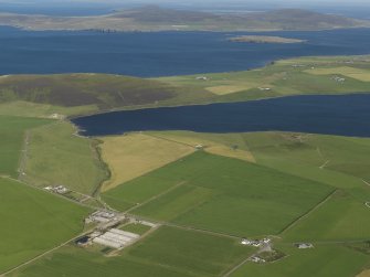 General oblique aerial view looking across the Loch of Swannay to Eynhallow Sound with Rousay beyond, taken from the WSW.