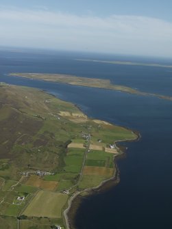 General oblique aerial view of looking along the S coast of Rousay with Wyre beyond, taken from the NW.