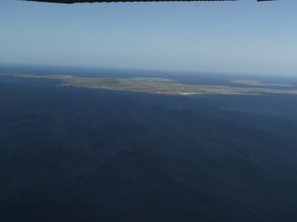 General oblique aerial view centered on Westray in the distance, taken from the SW.