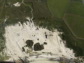 Oblique aerial view of the Links of Noltland showing the 2009 excavation area and the remains of earlier excavations, taken from the NNW.