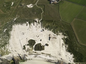 Oblique aerial view of the Links of Noltland showing the 2009 excavation area and the remains of earlier excavations, taken from the NNW.