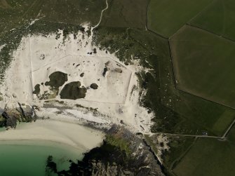Oblique aerial view of the Links of Noltland showing the 2009 excavation area and the remains of earlier excavations, taken from the NW.