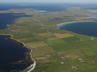 General oblique aerial view towards the SE of Westray across the Bay of Torquoy, taken from the NW.