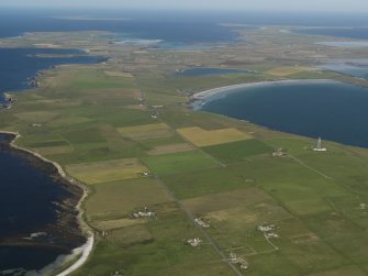 General oblique aerial view towards the SE of Westray across the Bay of Torquoy, taken from the NW.