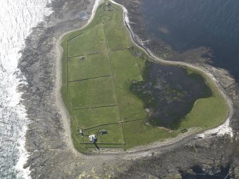 Oblique aerial view centred on Start Point lighthouse with Mount Maestry chambered cairn adjacent, taken from the E.