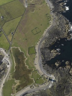 Oblique aerial view centred on the old lighthouse of Dennis Head with enclosures adjacent, taken from the SSE.
