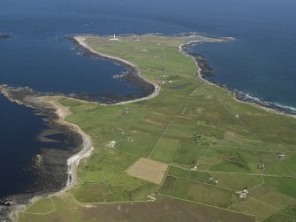 General oblique aerial view of the N end of North Ronaldsay looking towards Dennis Ness, taken from the SW.