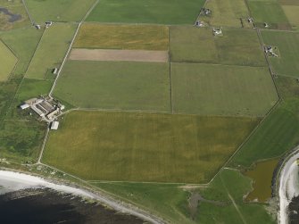 Oblique aerial view centred on the cropmarks of a possible field boundary and rig and furrow with Westbrough Steading adjacent, taken from the SSE.