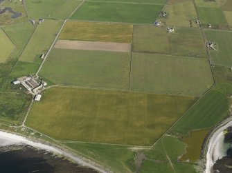 Oblique aerial view centred on the cropmarks of a possible field boundary and rig and furrow with Westbrough Steading adjacent, taken from the S.