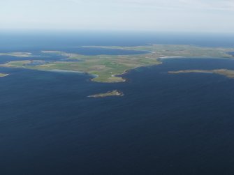 General oblique aerial view looking towards the Holm of Huip and Stronsay beyond, taken from the NE.