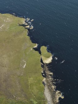 Oblique aerial view centred on the field system at Auld Man's Leg with turf cutting visible on the stack adjacent, taken from the WSW.