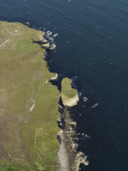 Oblique aerial view centred on the field system at Auld Man's Leg with turf cutting visible on the stack adjacent, taken from the WSW.