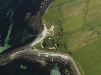 Oblique aerial view centred on the shell middens at Copinsay farmstead, taken from the SW.