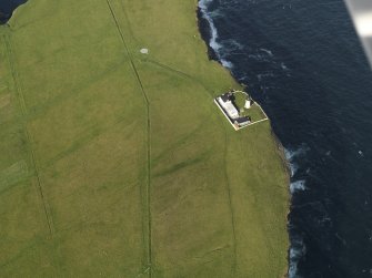 Oblique aerial view centred on Copinsay lighthouse, taken from the SW.