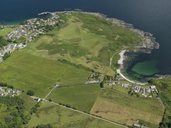 General oblique aerial view centred on the golf course and Port Righ with  Carradale adjacent, taken from the SW.